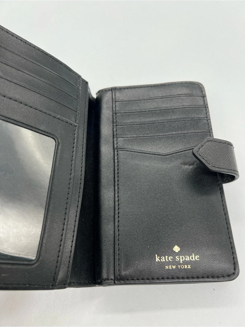 kate spade Black Saffiano Zip Around Wallet with Gold Logo